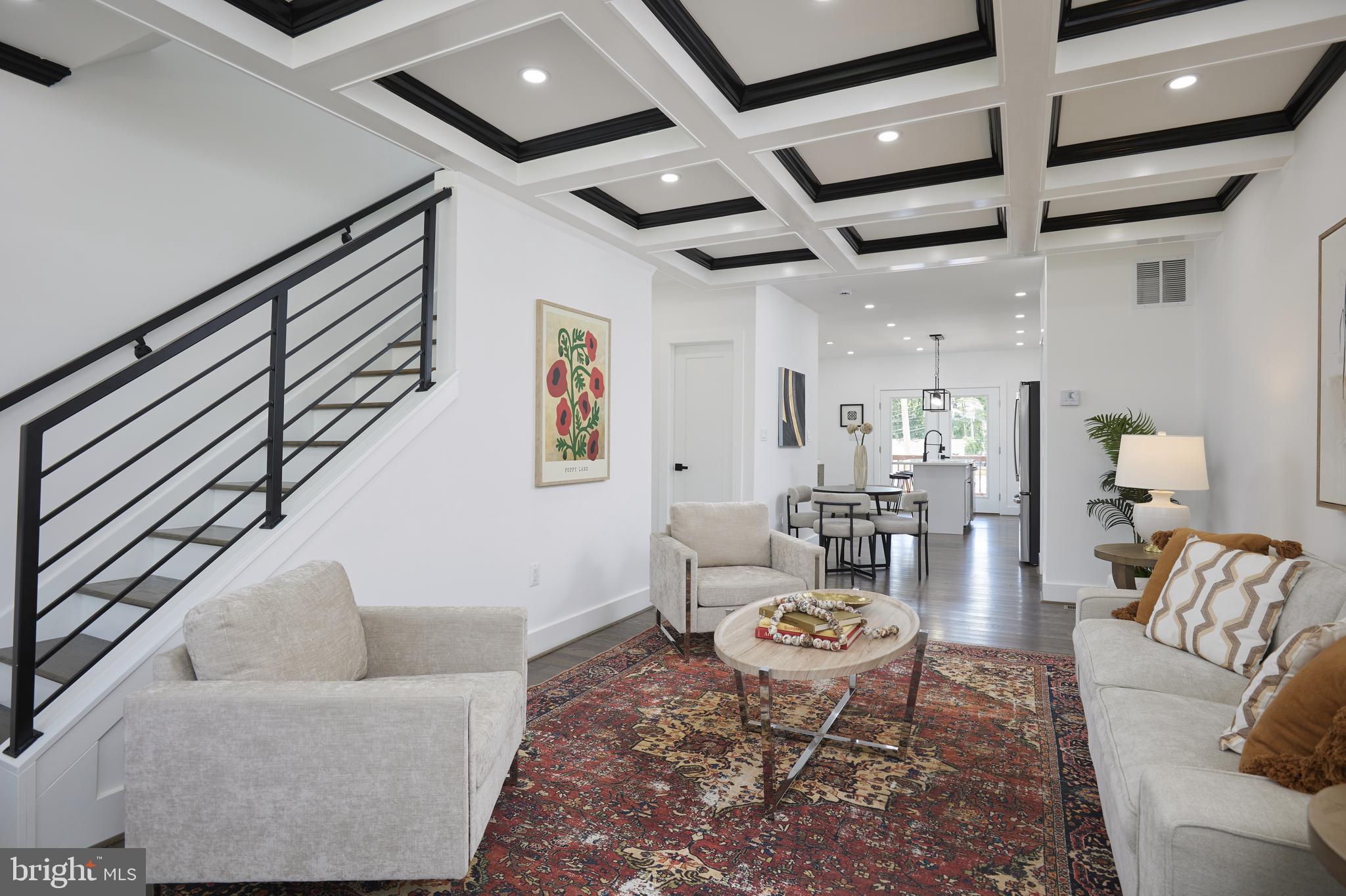 a living room with furniture and a rug