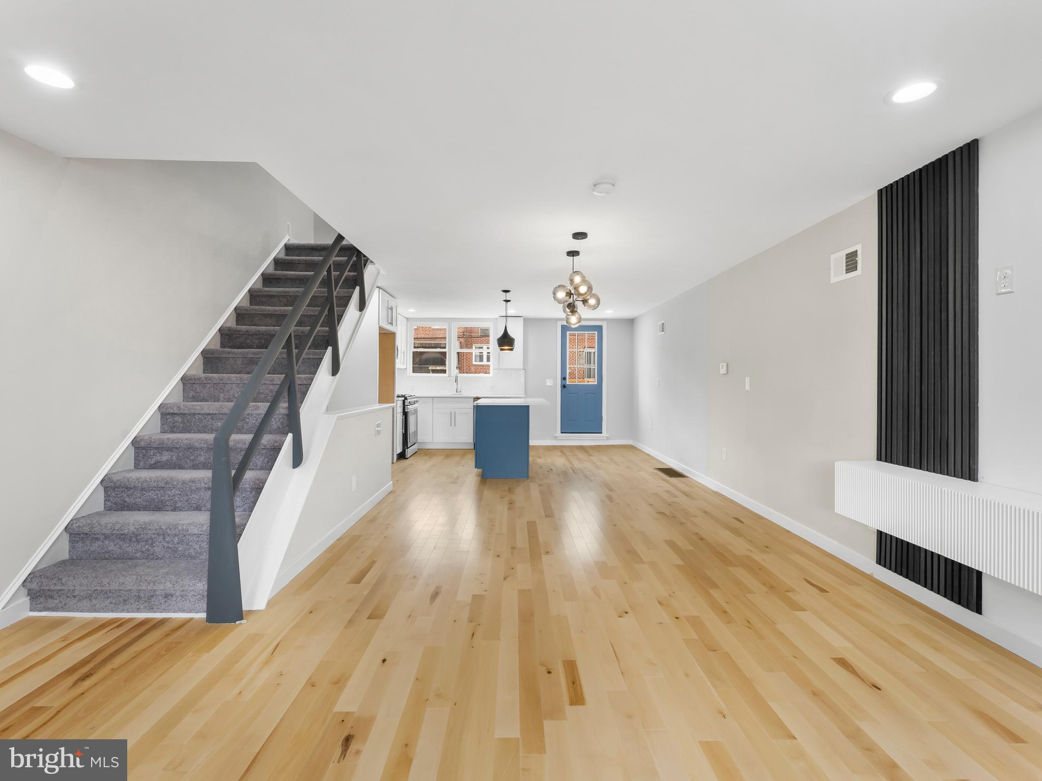 a view of a living room with wooden floor