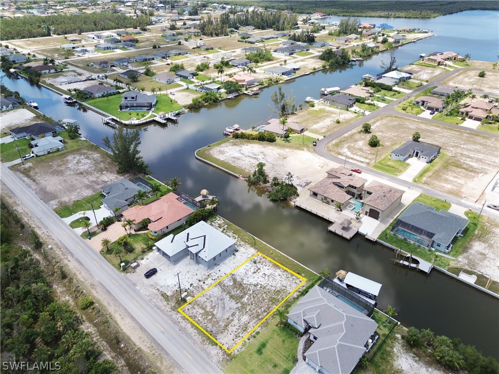 an aerial view of a city with lake