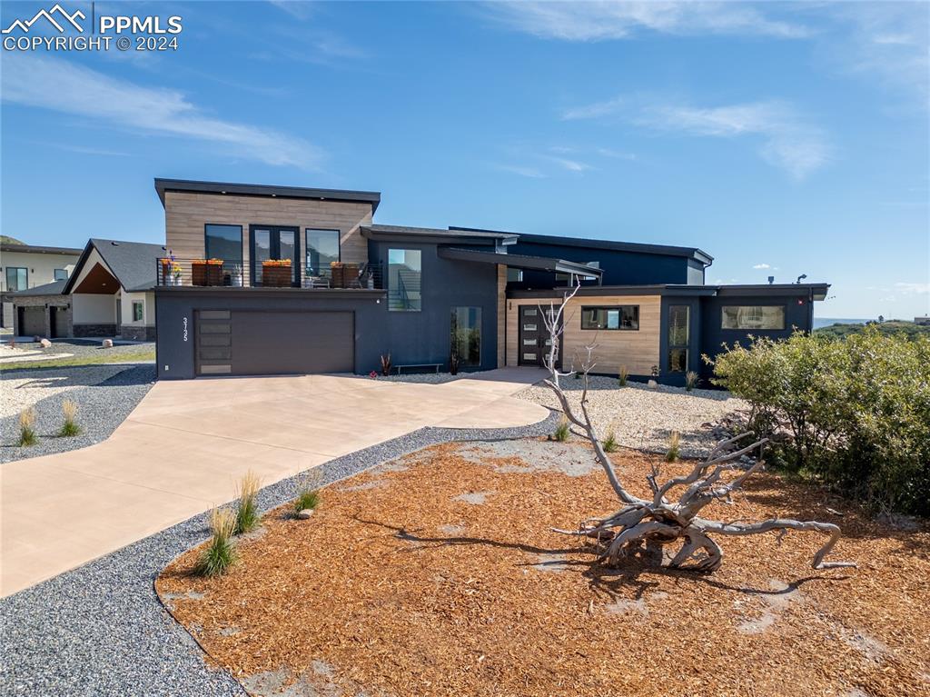 a view of house with yard and entertaining space