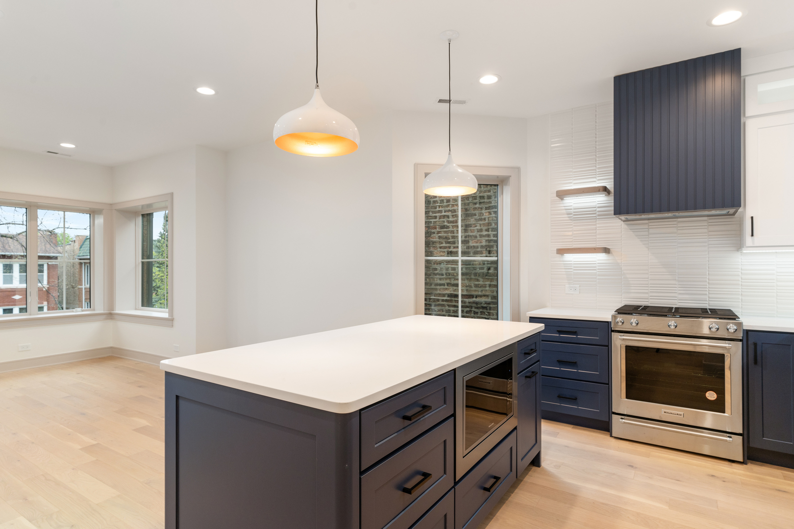 a kitchen with a stove and a sink