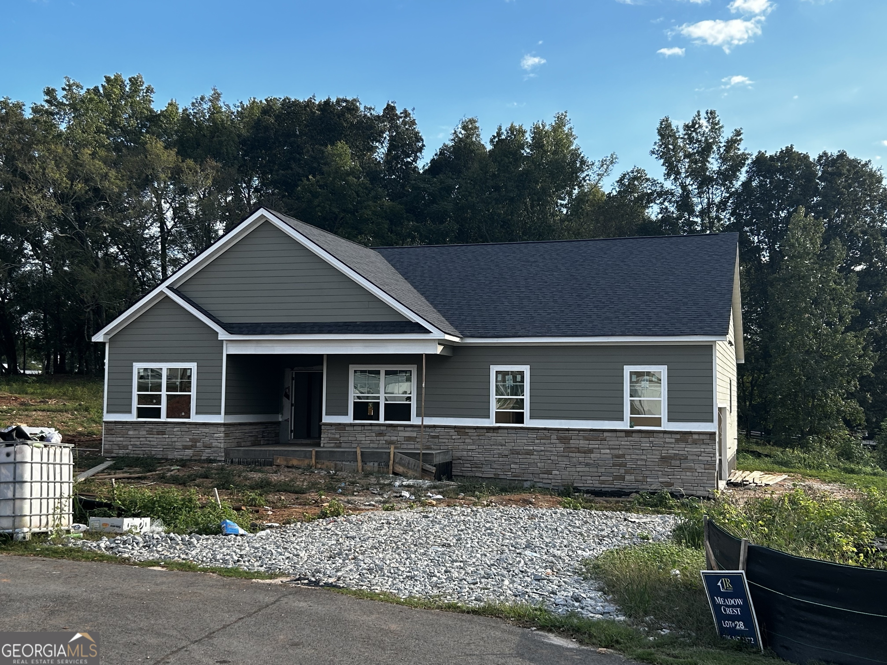 front view of a house with a yard