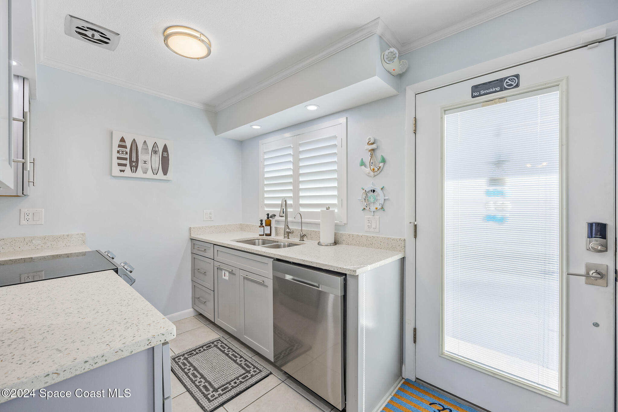 a utility room with a sink dryer and washer