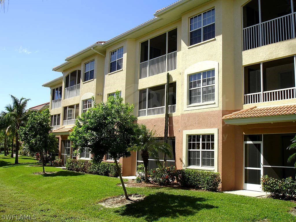 a front view of a building with a garden