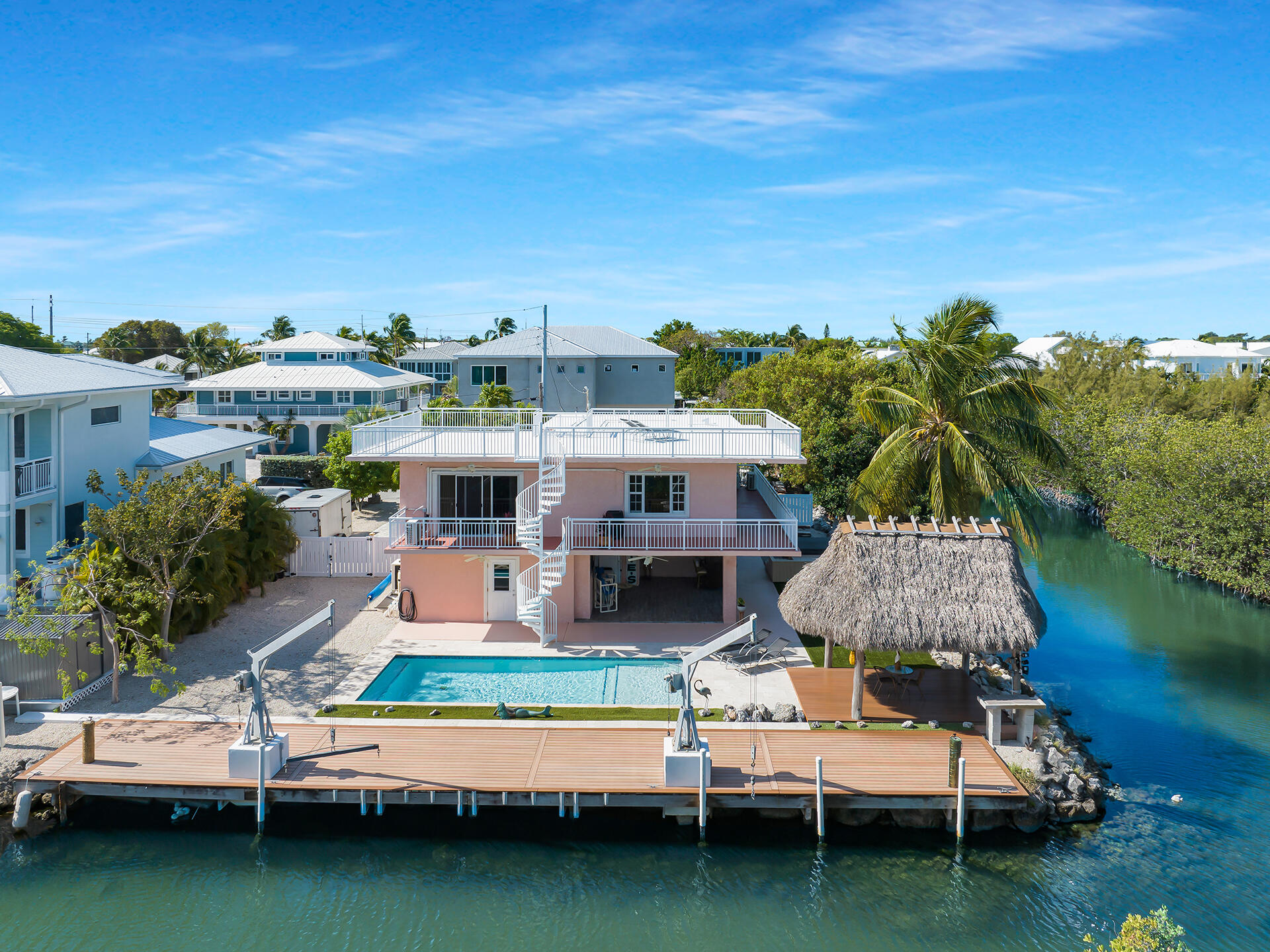 a house with swimming pool in front of it