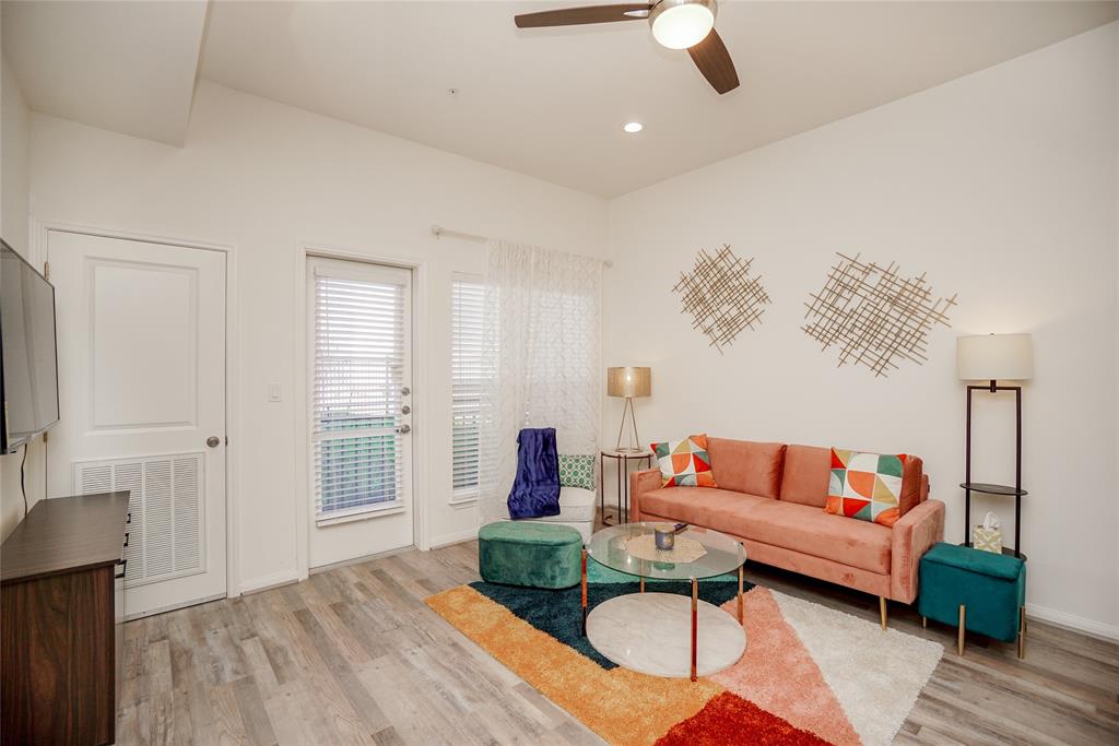 a bedroom with furniture and a lamp