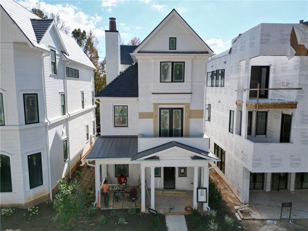 a aerial view of a brick house with a yard