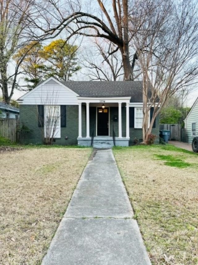 front view of a house with a yard