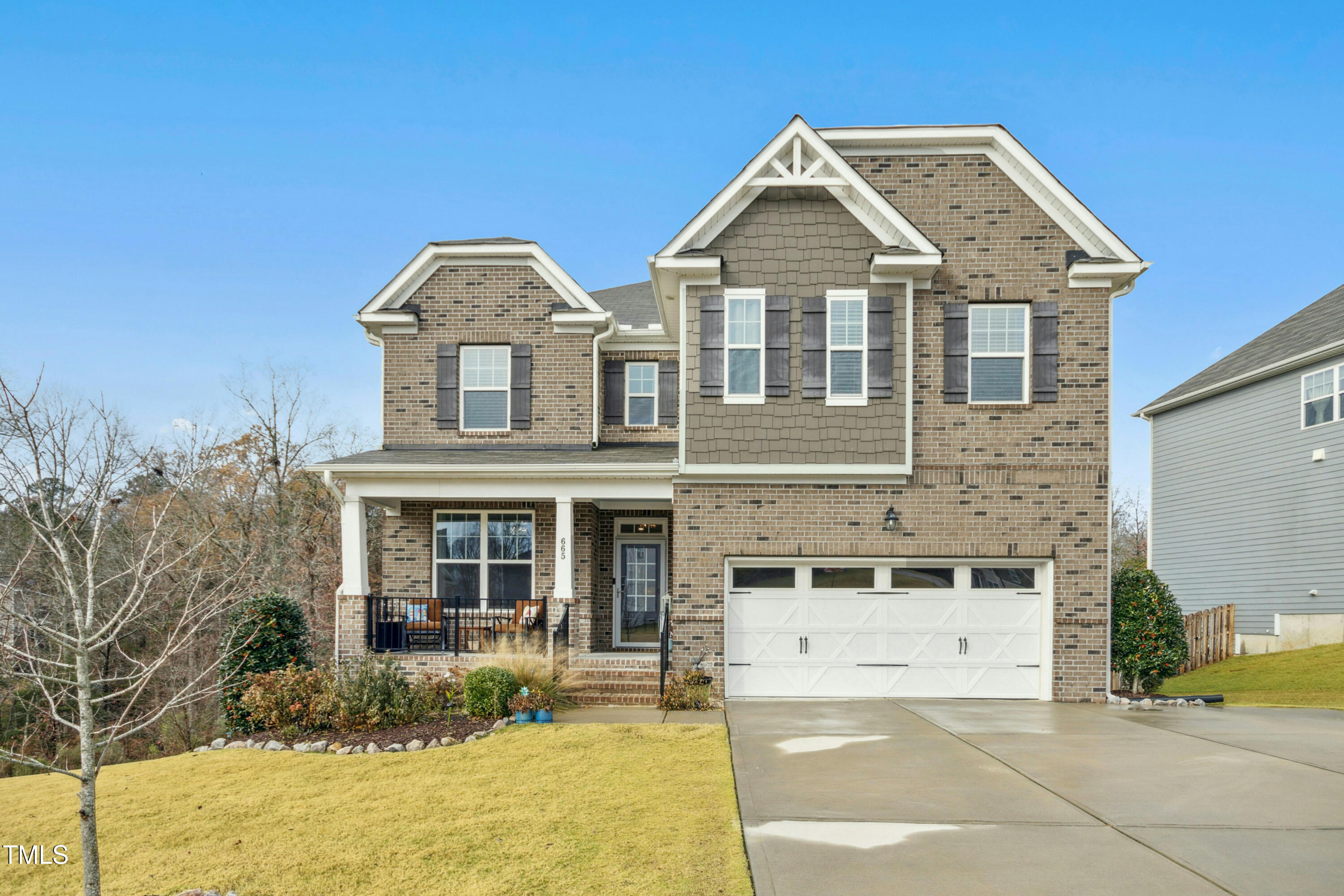 front view of a house with a yard