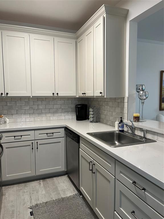 a kitchen with a sink and cabinets