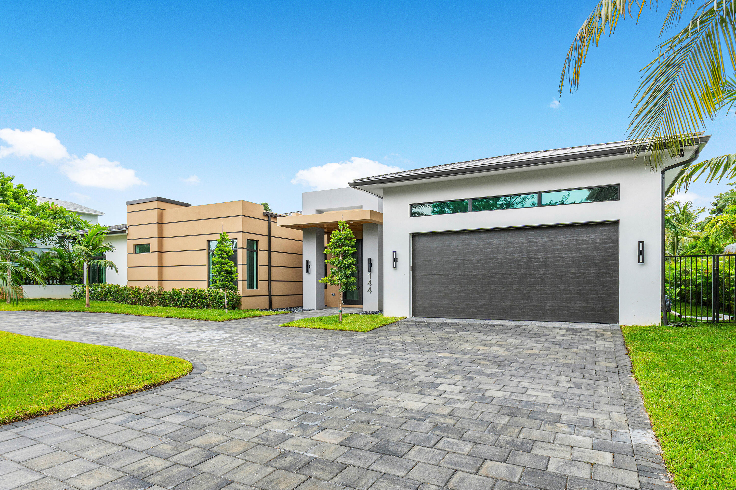 a view of a house with a yard and garage