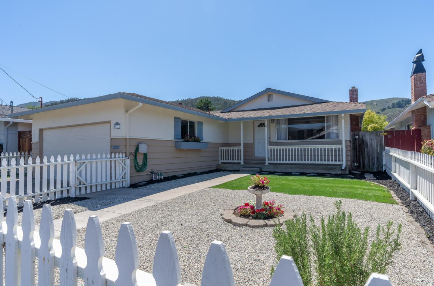 a front view of house with yard and outdoor seating