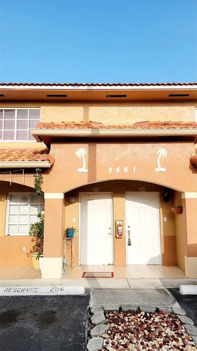 a front view of a house with a outdoor space