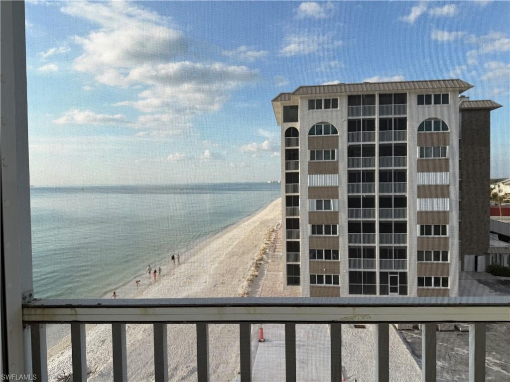 Property view of water featuring a beach view