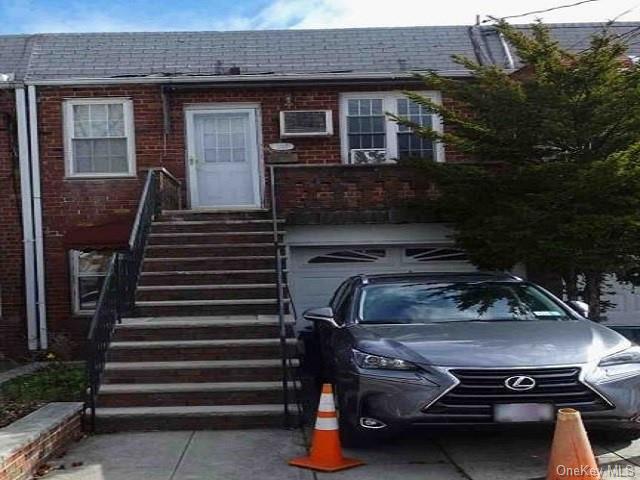 a view of a car park in front of house