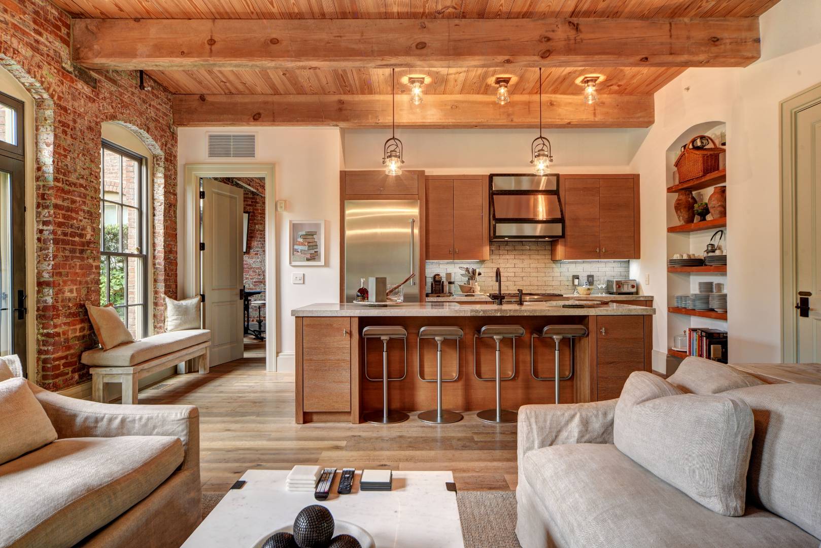 a living room with furniture and wooden floor