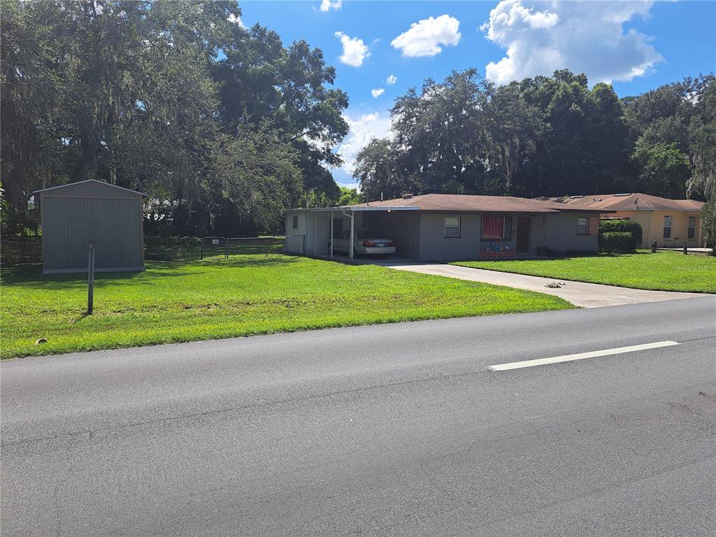 a house that has a tree in front of it