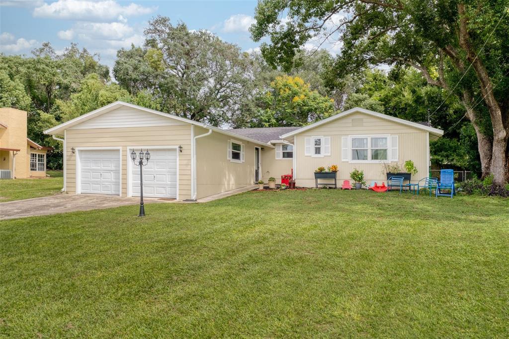 a view of a house with a yard