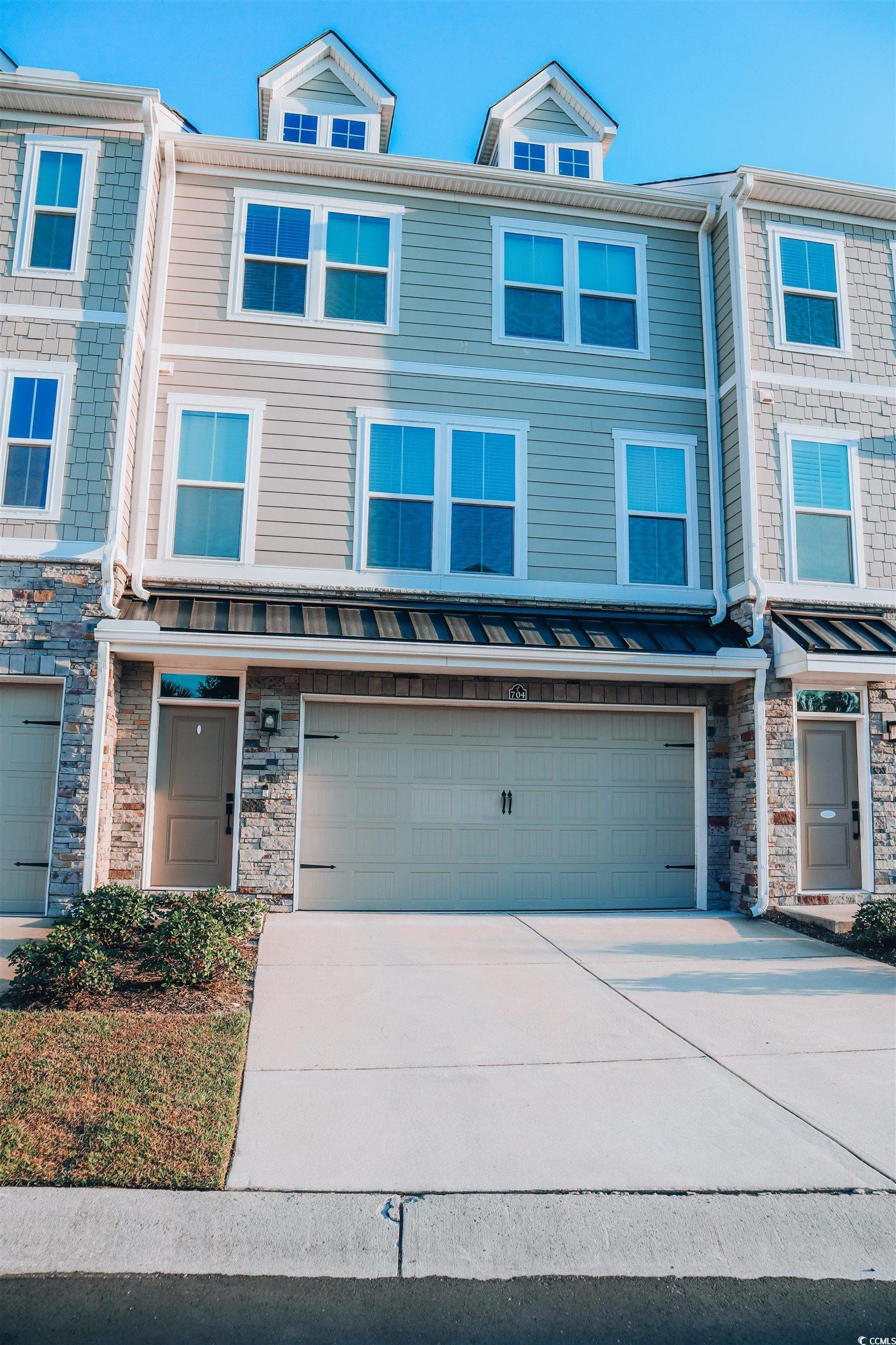 View of property featuring a garage