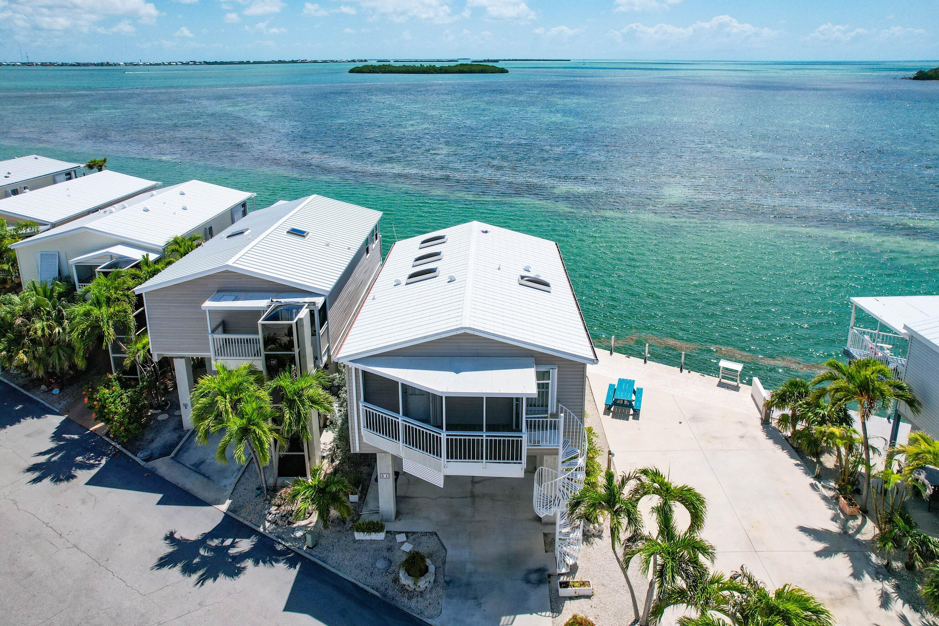 a aerial view of a house with a yard