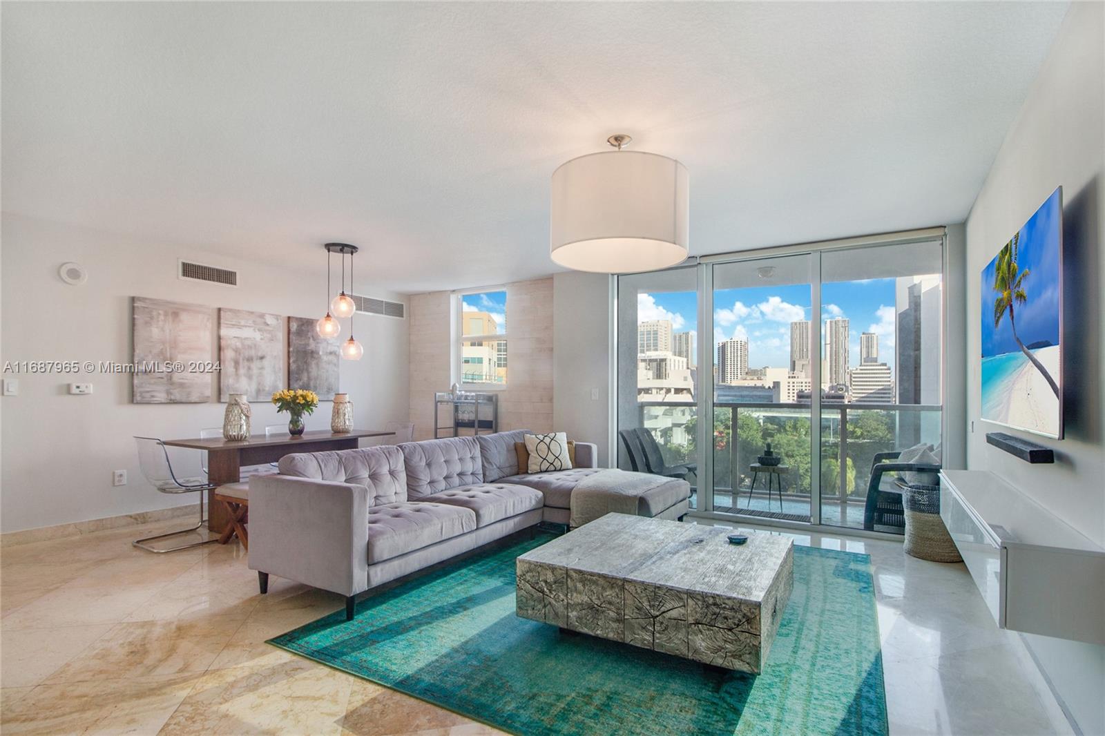 a living room with furniture and a flat screen tv