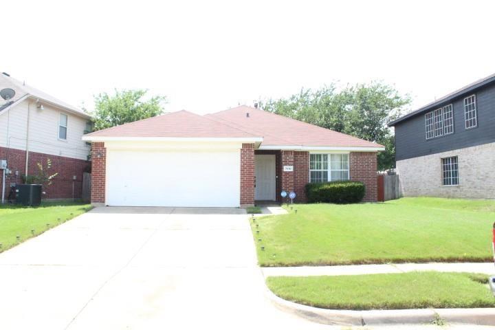 a view of a house with a yard and garage