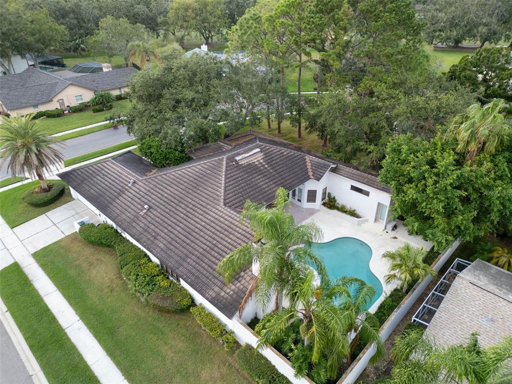 an aerial view of house with yard