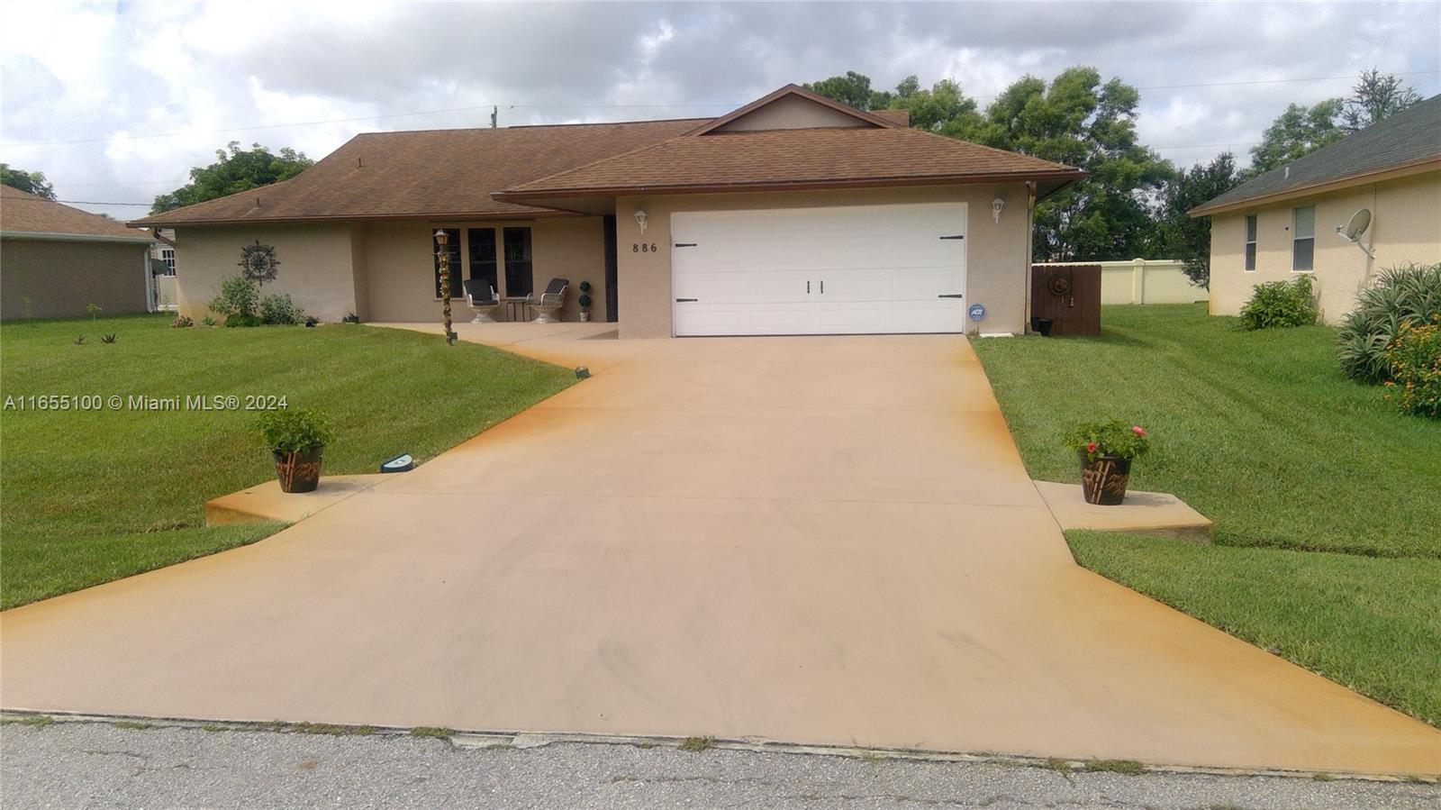 a front view of a house with yard