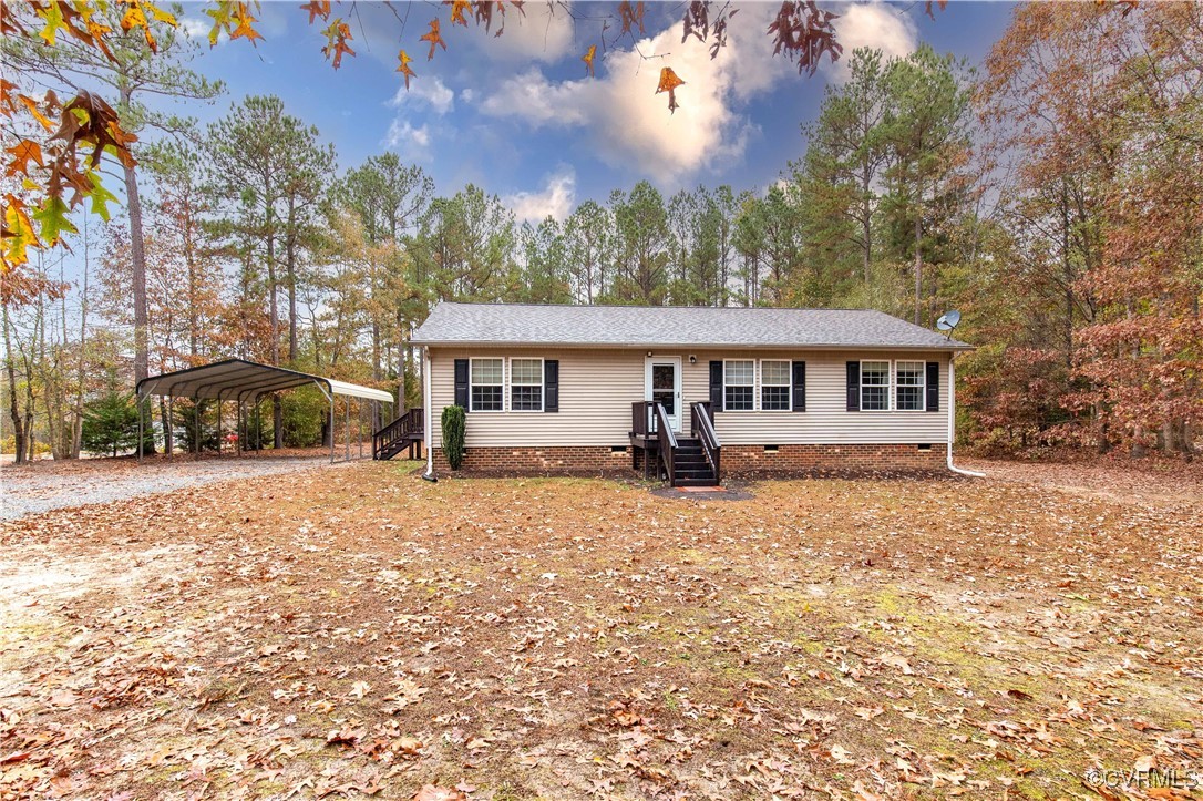 View of front of house featuring a carport