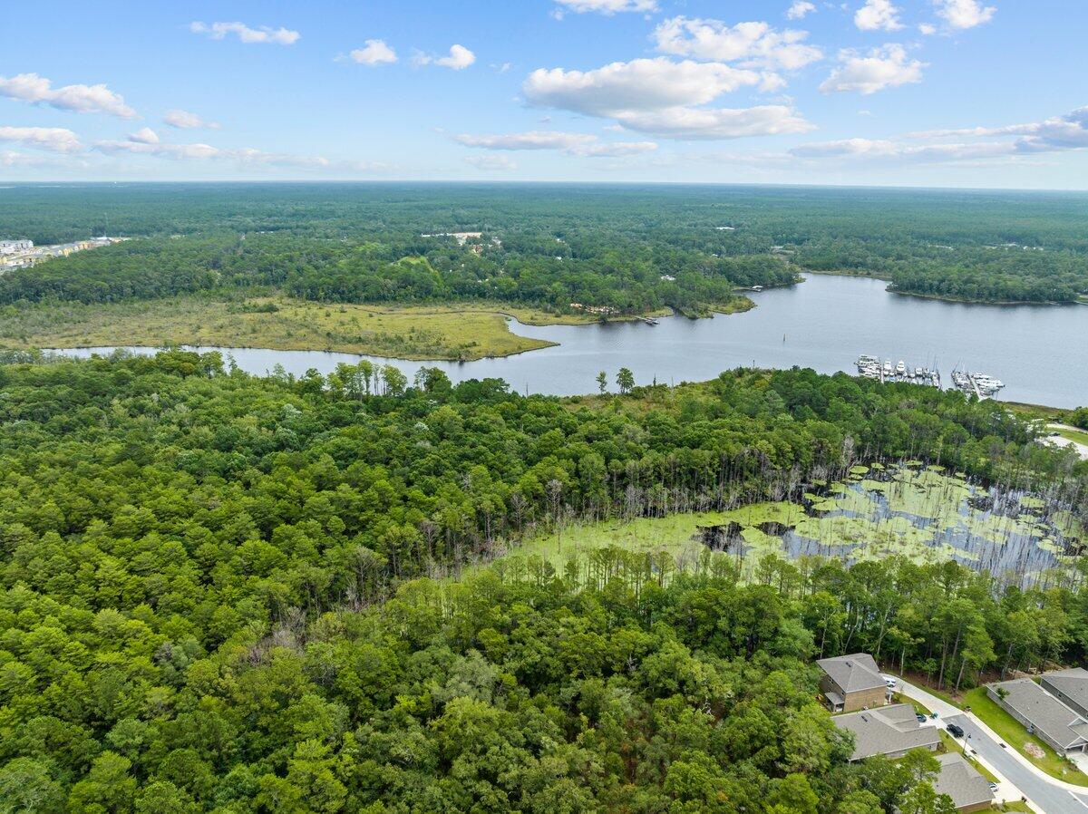 a view of a lake with houses in the back