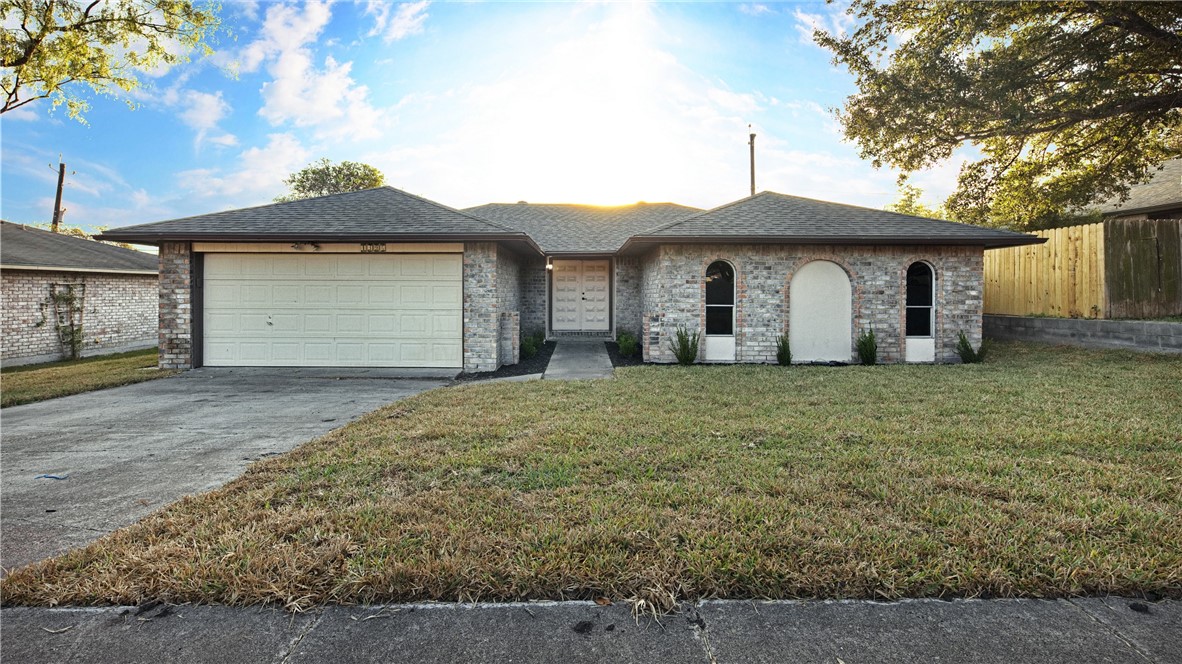 a front view of a house with yard