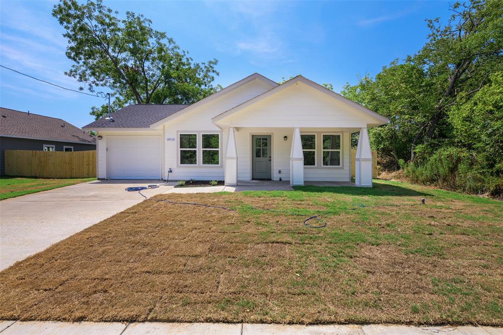 front view of a house with a yard