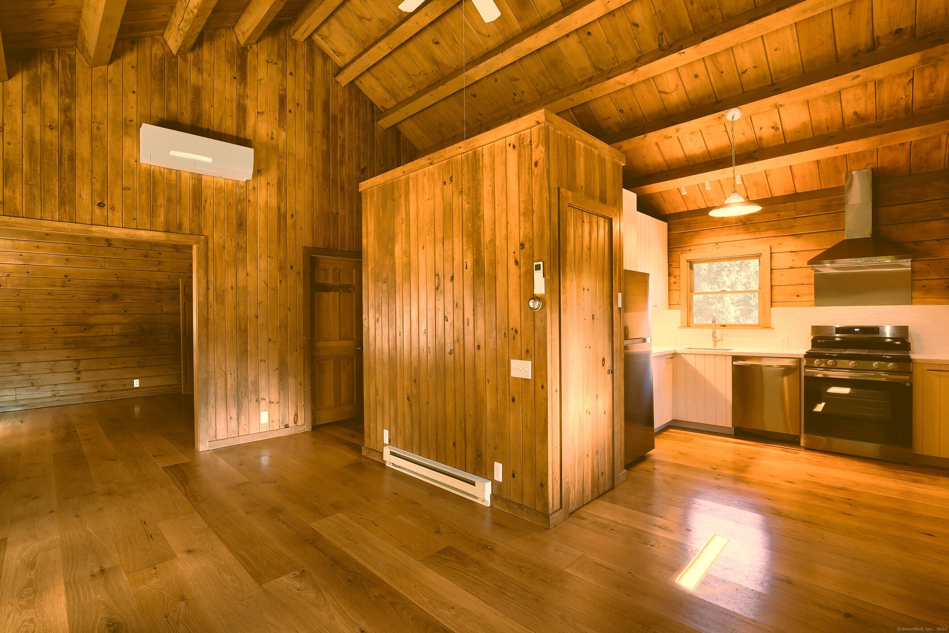 a view of a bathroom with a shower and a tub