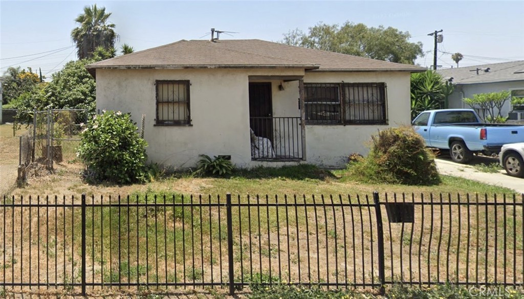 a view of a house with a garden