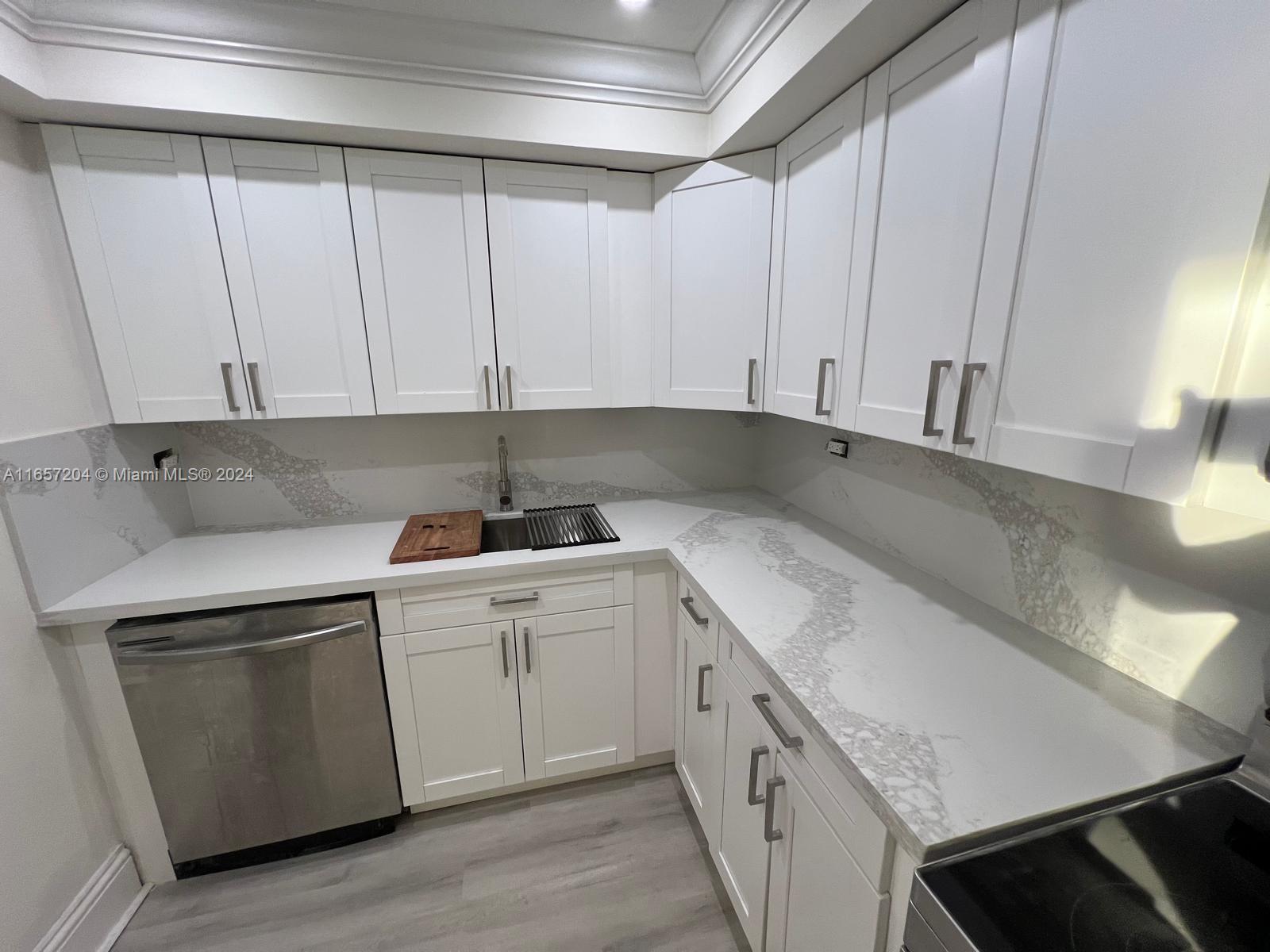 a kitchen with a sink and cabinets