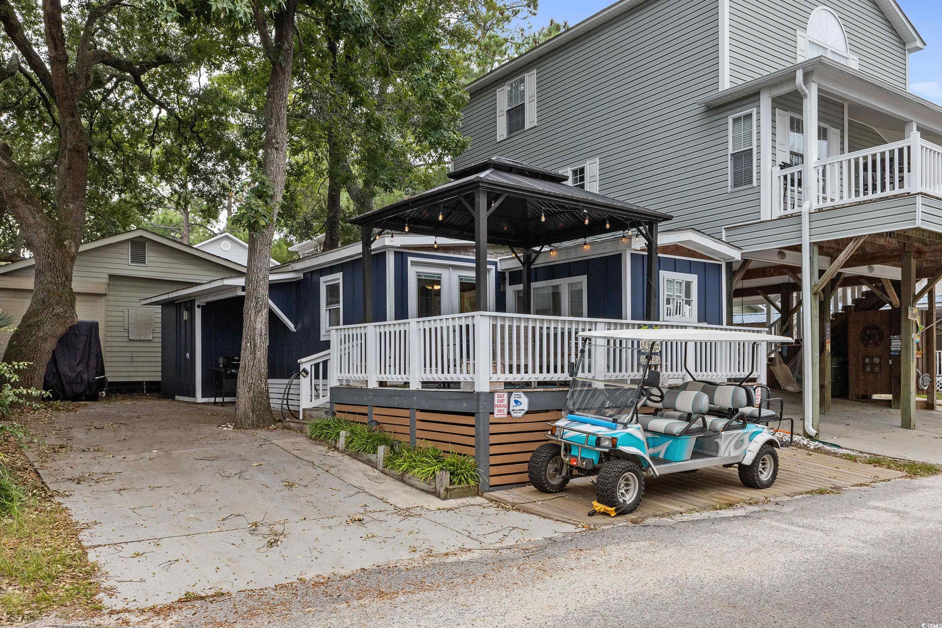 View of front facade featuring a deck and a gazebo