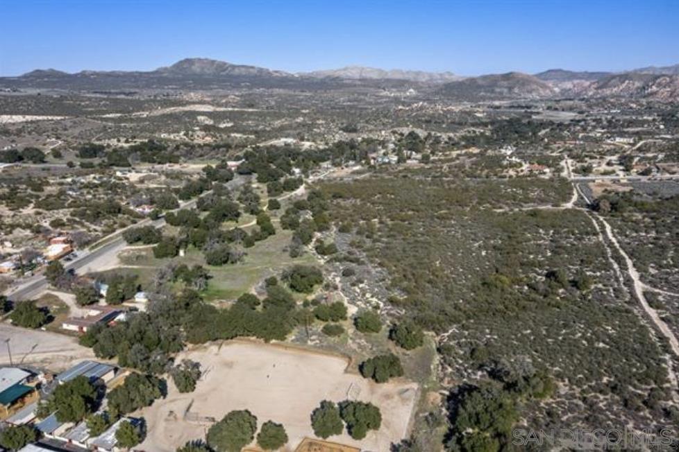 a view of a field with a mountain in the background