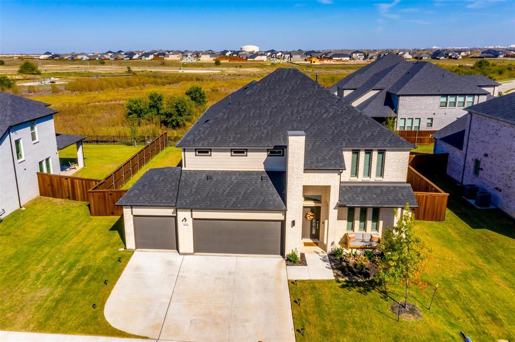 an aerial view of a house with a swimming pool