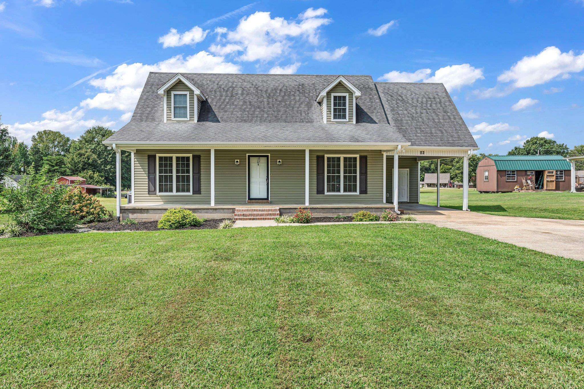 front view of a house with a yard