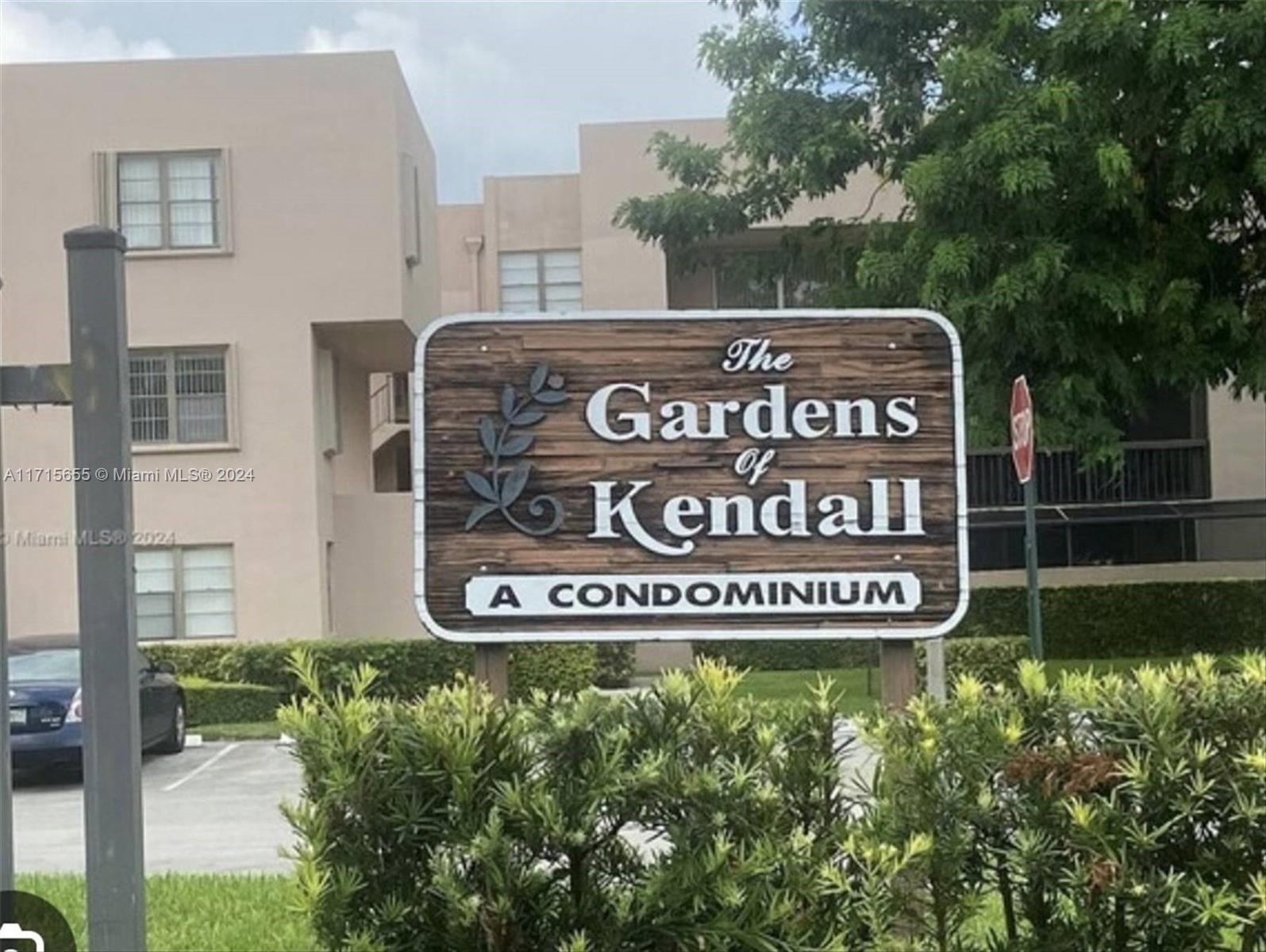 a sign broad in front of red brick house