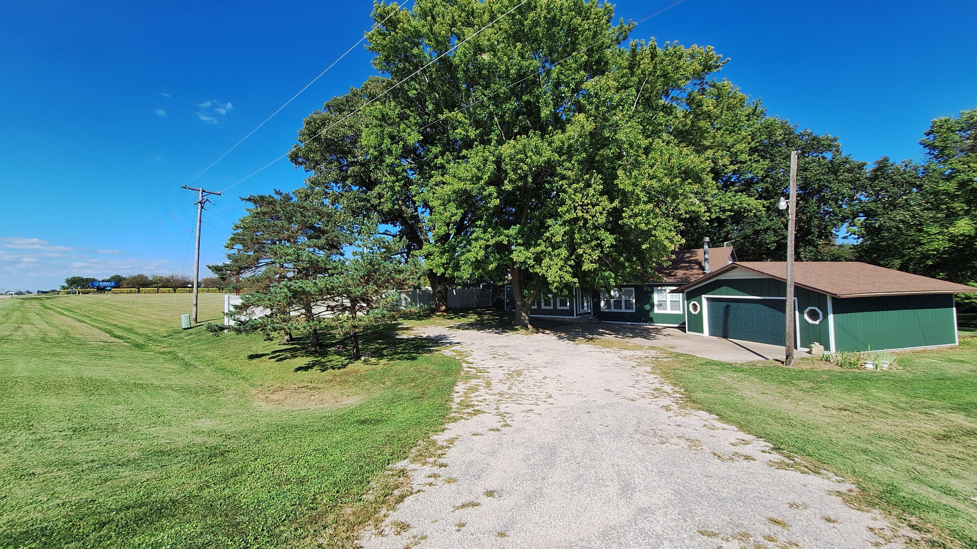 a view of a house with a yard