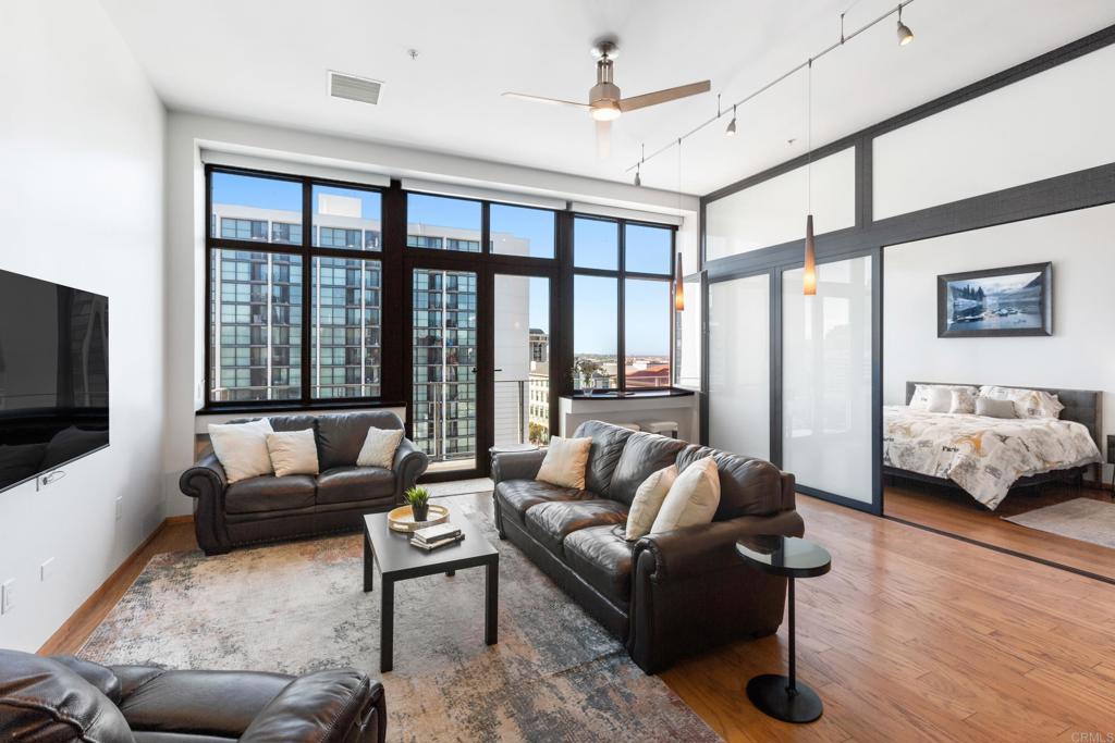 a living room with furniture or couch and a flat screen tv