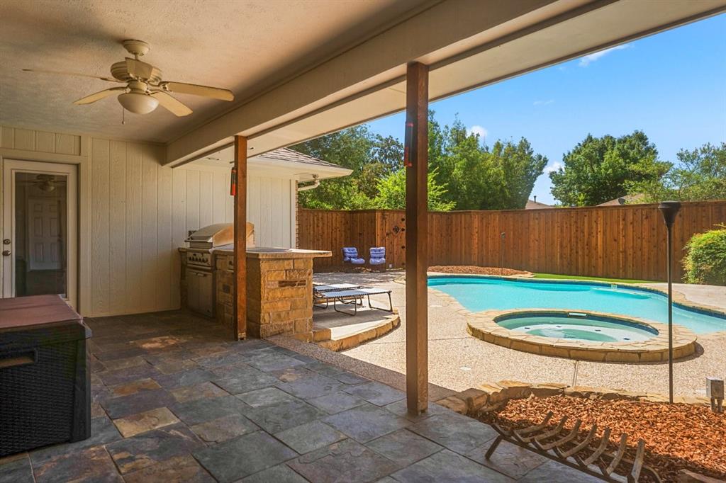 a view of a swimming pool and outdoor seating