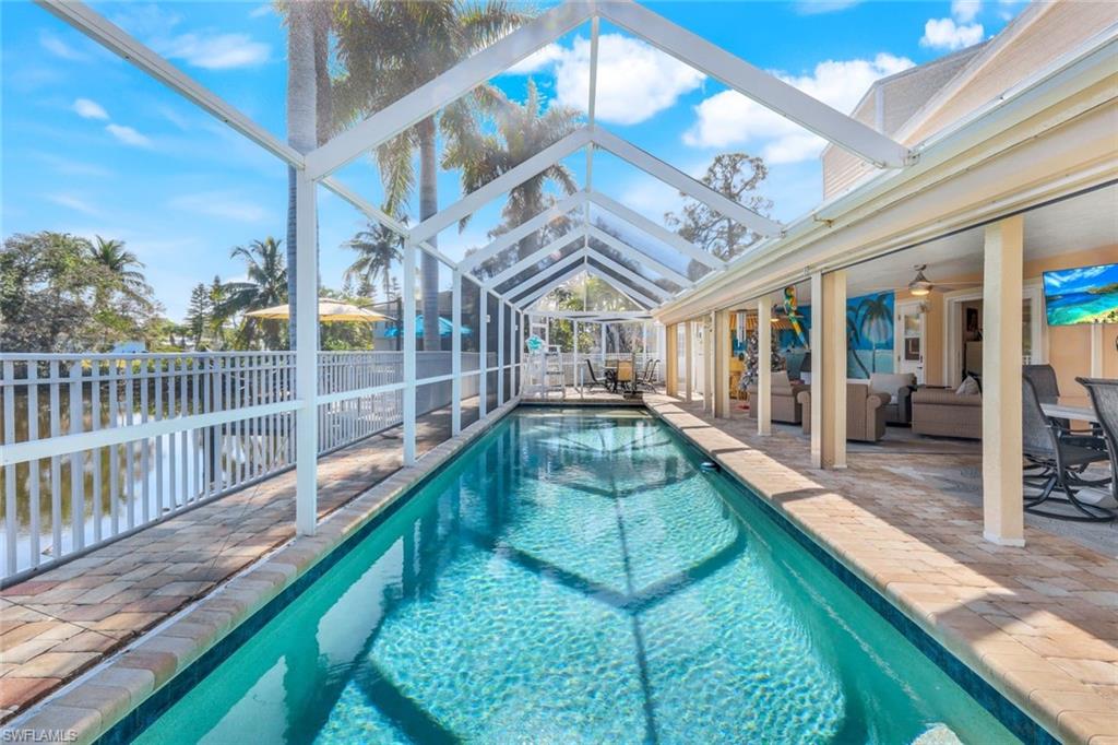 a swimming pool with a outdoor seating