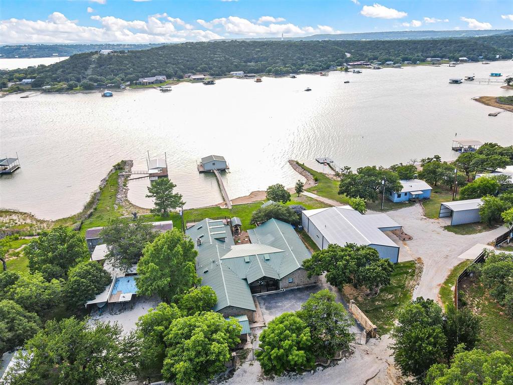 an aerial view of ocean with residential house and lake view