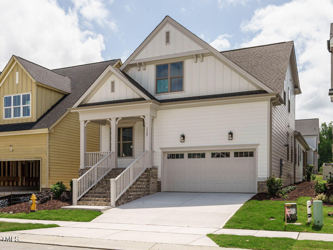 a front view of a house with garage