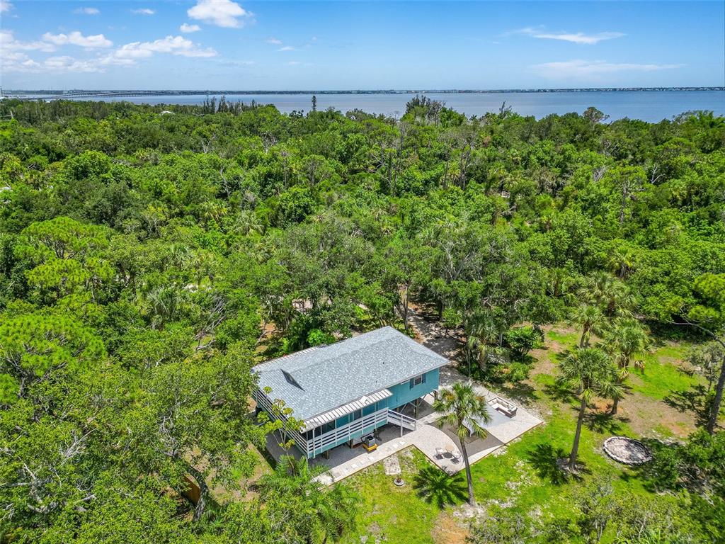 an aerial view of a house with a yard