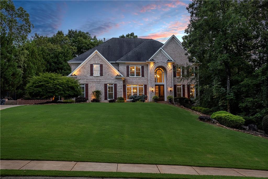 a front view of a house with a yard