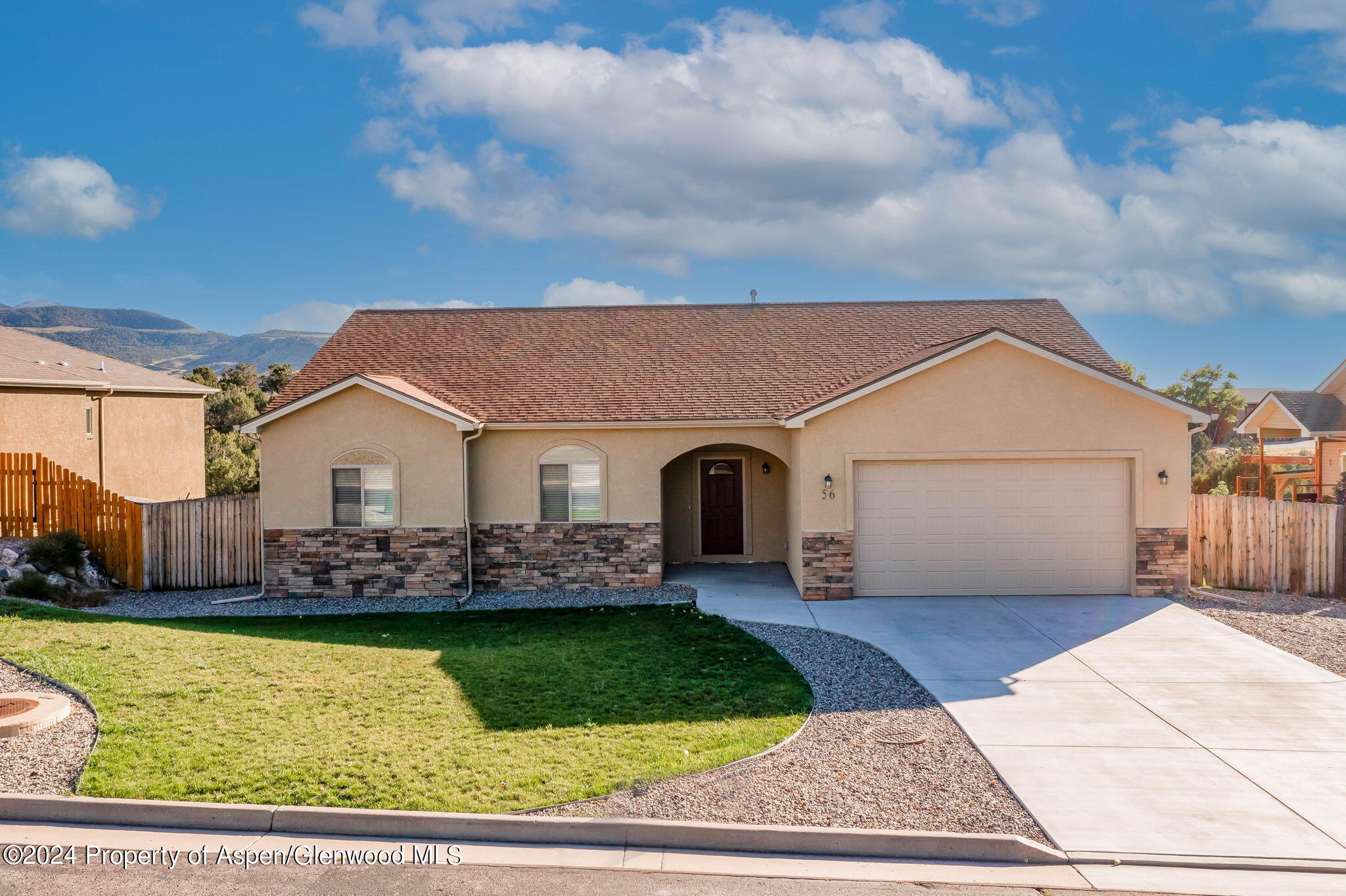 a front view of house with yard having outdoor seating