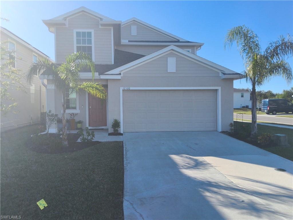 View of property with a garage